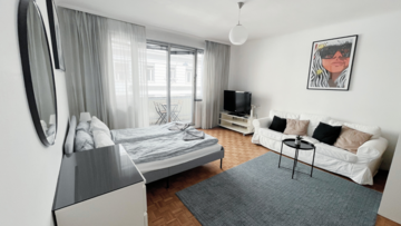 Wohnzimmer mit Doppelbett